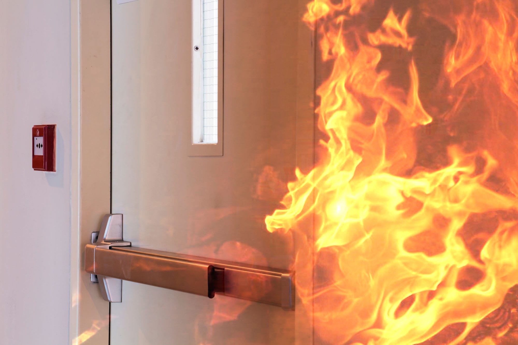 Fire burning near emergency exit door