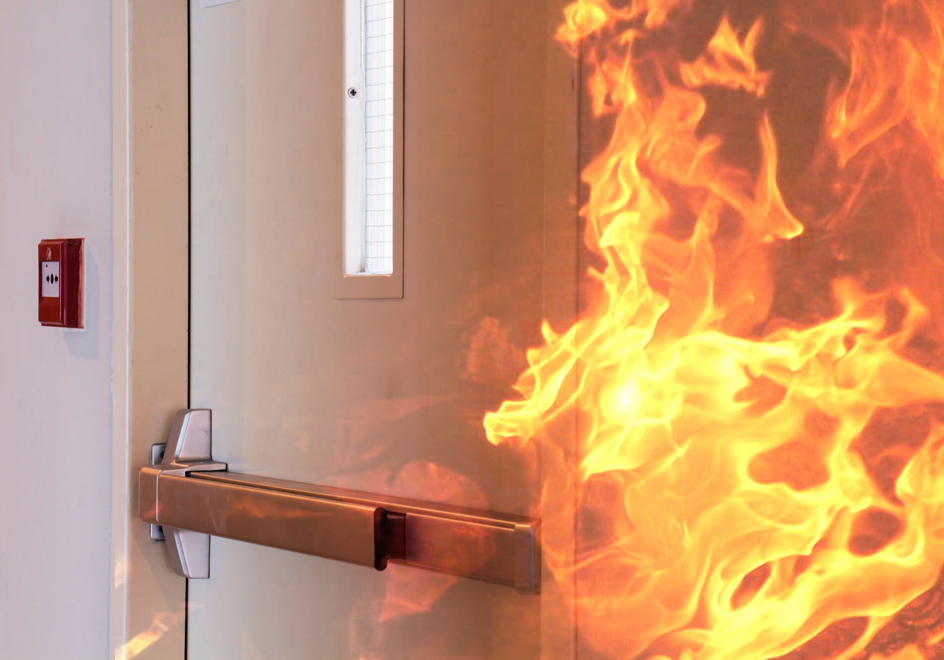 Fire burning near emergency exit door